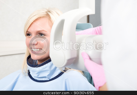 To use this stock image in your creative project, please select the size you need over to the right and click the "Add to Cart" button.
Your downloaded image will come with the Cutcaster watermark removed so don’t worry about the watermark you see on this page. Dental X-Ray stock photo, A woman having her teeth x-rayed by Tyler Olson