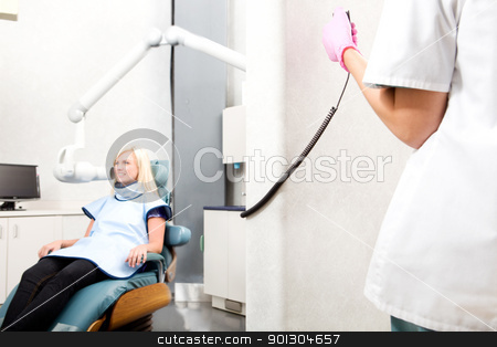 To use this stock image in your creative project, please select the size you need over to the right and click the "Add to Cart" button.
Your downloaded image will come with the Cutcaster watermark removed so don’t worry about the watermark you see on this page. Dental X-Ray stock photo, A dentist taking an x-ray of a patient by Tyler Olson