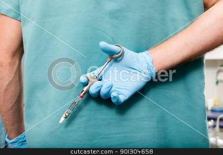 To use this stock image in your creative project, please select the size you need over to the right and click the "Add to Cart" button.
Your downloaded image will come with the Cutcaster watermark removed so don’t worry about the watermark you see on this page. Big Dentist Needle stock photo, A large needle behind the back of a dentist by Tyler Olson