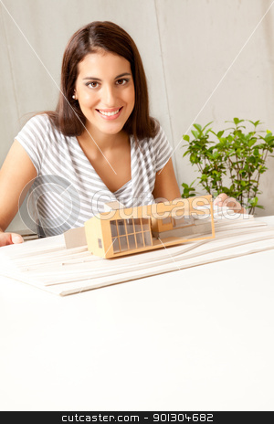 To use this stock image in your creative project, please select the size you need over to the right and click the "Add to Cart" button.
Your downloaded image will come with the Cutcaster watermark removed so don’t worry about the watermark you see on this page. Young Architect stock photo, A young female architect smiling at the camera with a house model by Tyler Olson