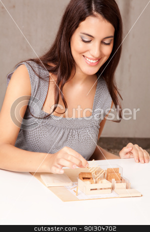 To use this stock image in your creative project, please select the size you need over to the right and click the "Add to Cart" button.
Your downloaded image will come with the Cutcaster watermark removed so don’t worry about the watermark you see on this page. Interior Architect stock photo, A female interior architect designign a scale model house by Tyler Olson