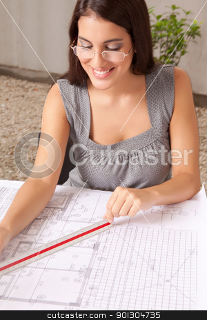 To use this stock image in your creative project, please select the size you need over to the right and click the "Add to Cart" button.
Your downloaded image will come with the Cutcaster watermark removed so don’t worry about the watermark you see on this page. Architect Checking Blueprints stock photo, A female architect checking over blueprints, measuring with a scaled ruler by Tyler Olson