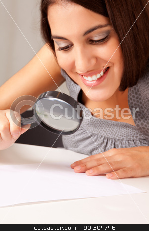 To use this stock image in your creative project, please select the size you need over to the right and click the "Add to Cart" button.
Your downloaded image will come with the Cutcaster watermark removed so don’t worry about the watermark you see on this page. Woman with Magnifying Glass stock photo, A prety brunette woman looking at a paper with a magnifying glass by Tyler Olson