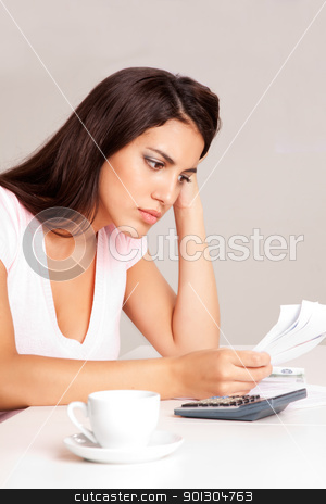 To use this stock image in your creative project, please select the size you need over to the right and click the "Add to Cart" button.
Your downloaded image will come with the Cutcaster watermark removed so don’t worry about the watermark you see on this page. Woman Budget Planning stock photo, A woman sitting at a desk with calculator and papers planning a budget by Tyler Olson
