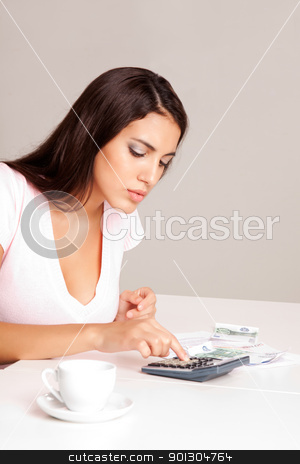 To use this stock image in your creative project, please select the size you need over to the right and click the "Add to Cart" button.
Your downloaded image will come with the Cutcaster watermark removed so don’t worry about the watermark you see on this page. Home Finances stock photo, A woman sitting at a table with calculator, papers and coffee cup by Tyler Olson