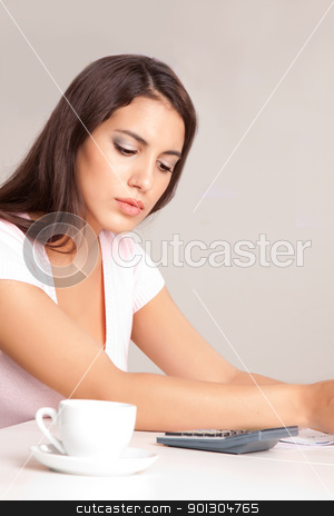 To use this stock image in your creative project, please select the size you need over to the right and click the "Add to Cart" button.
Your downloaded image will come with the Cutcaster watermark removed so don’t worry about the watermark you see on this page. Woman Calculating Finances stock photo, A woman sitting at a desk calculating finances by Tyler Olson