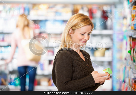 To use this stock image in your creative project, please select the size you need over to the right and click the "Add to Cart" button.
Your downloaded image will come with the Cutcaster watermark removed so don’t worry about the watermark you see on this page. Young woman smiling while shopping stock photo, Young woman smiling while shopping in the supermarket with people in the background by Tyler Olson