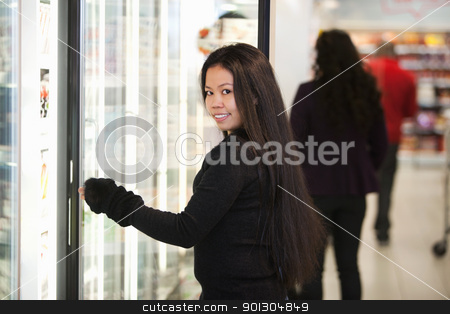 To use this stock image in your creative project, please select the size you need over to the right and click the "Add to Cart" button.
Your downloaded image will come with the Cutcaster watermark removed so don’t worry about the watermark you see on this page. Young woman smiling while opening refrigerator in supermarket stock photo, Young woman smiling while opening refrigerator in supermarket with people in the background by Tyler Olson