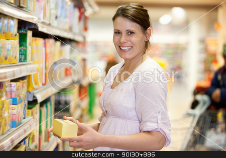 To use this stock image in your creative project, please select the size you need over to the right and click the "Add to Cart" button.
Your downloaded image will come with the Cutcaster watermark removed so don’t worry about the watermark you see on this page. Young Female in Supermarket stock photo, Mid adult woman holding product and looking at camera in shopping centre by Tyler Olson