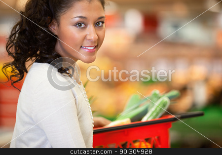 To use this stock image in your creative project, please select the size you need over to the right and click the "Add to Cart" button.
Your downloaded image will come with the Cutcaster watermark removed so don’t worry about the watermark you see on this page. Supermarket Shopping Woman Portrait stock photo, Close-up of young woman with red basket in supermarket and looking at camera by Tyler Olson