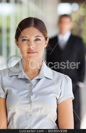 To use this stock image in your creative project, please select the size you need over to the right and click the "Add to Cart" button.
Your downloaded image will come with the Cutcaster watermark removed so don’t worry about the watermark you see on this page. Young attractive businesswoman stock photo, Portrait of an young attractive businesswoman with man standing in background by Tyler Olson