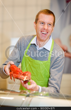 To use this stock image in your creative project, please select the size you need over to the right and click the "Add to Cart" button.
Your downloaded image will come with the Cutcaster watermark removed so don’t worry about the watermark you see on this page. Lobster stock photo, A man at a grocery store selling a lobster by Tyler Olson