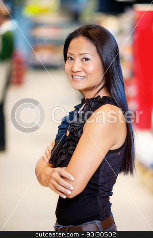 To use this stock image in your creative project, please select the size you need over to the right and click the "Add to Cart" button.
Your downloaded image will come with the Cutcaster watermark removed so don’t worry about the watermark you see on this page. Asian Woman in Grocery Store stock photo, Confident smiling asian woman with arms crossed in shopping centre looking at camera by Tyler Olson