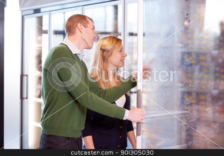 To use this stock image in your creative project, please select the size you need over to the right and click the "Add to Cart" button.
Your downloaded image will come with the Cutcaster watermark removed so don’t worry about the watermark you see on this page. Couple in Frozen Food Section stock photo, A happy couple buying groceries in the frozen food section of a supermarket by Tyler Olson
