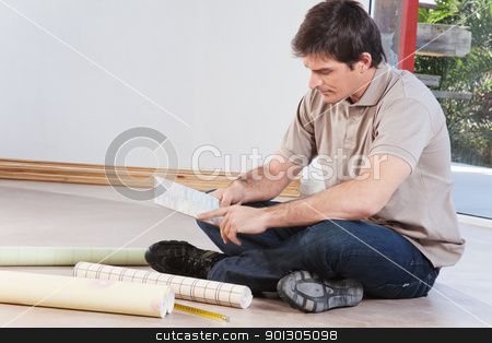 To use this stock image in your creative project, please select the size you need over to the right and click the "Add to Cart" button.
Your downloaded image will come with the Cutcaster watermark removed so don’t worry about the watermark you see on this page. Young man looking at color sample stock photo, Young man sitting on floor looking at paint color swatch by Tyler Olson