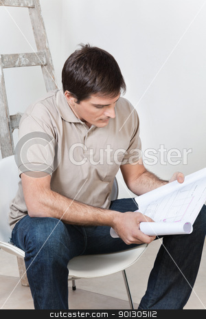 To use this stock image in your creative project, please select the size you need over to the right and click the "Add to Cart" button.
Your downloaded image will come with the Cutcaster watermark removed so don’t worry about the watermark you see on this page. Man looking at blueprint stock photo, Portrait of young smart man looking at blueprint by Tyler Olson