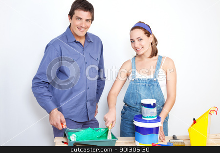 To use this stock image in your creative project, please select the size you need over to the right and click the "Add to Cart" button.
Your downloaded image will come with the Cutcaster watermark removed so don’t worry about the watermark you see on this page. Portrait of happy couple with paint tools stock photo, Portrait of happy couple with roller, paint and bucket on table by Tyler Olson