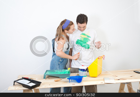 To use this stock image in your creative project, please select the size you need over to the right and click the "Add to Cart" button.
Your downloaded image will come with the Cutcaster watermark removed so don’t worry about the watermark you see on this page. Wife painting on t-shirt stock photo, Young wife painting on t-shirt of husband by Tyler Olson