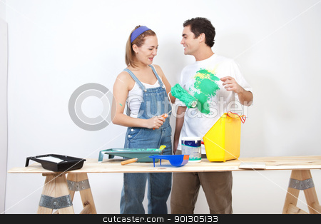 To use this stock image in your creative project, please select the size you need over to the right and click the "Add to Cart" button.
Your downloaded image will come with the Cutcaster watermark removed so don’t worry about the watermark you see on this page. Playful young couple stock photo, Smiling woman painting husband's t-shirt with roller by Tyler Olson