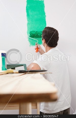 To use this stock image in your creative project, please select the size you need over to the right and click the "Add to Cart" button.
Your downloaded image will come with the Cutcaster watermark removed so don’t worry about the watermark you see on this page. Man paining house with roller stock photo, Rear view of man painting his house with color roller by Tyler Olson