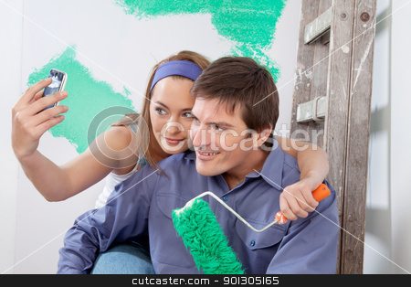 To use this stock image in your creative project, please select the size you need over to the right and click the "Add to Cart" button.
Your downloaded image will come with the Cutcaster watermark removed so don’t worry about the watermark you see on this page. Happy couple taking a snapshot of themselves stock photo, Young happy couple taking a snapshot of themselves with cellphone by Tyler Olson