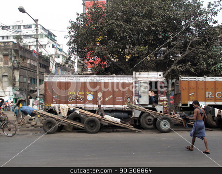 To use this stock image in your creative project, please select the size you need over to the right and click the "Add to Cart" button.
Your downloaded image will come with the Cutcaster watermark removed so don’t worry about the watermark you see on this page. Trucks and carts wait for customers stock photo, KOLKATA, INDIA -JANUARY 25: Streets of Kolkata. Trucks and carts wait for customers to transport their cargo, January 25, 2009. by Zvonimir Atletic