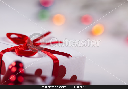 To use this stock image in your creative project, please select the size you need over to the right and click the "Add to Cart" button.
Your downloaded image will come with the Cutcaster watermark removed so don’t worry about the watermark you see on this page. Gift background stock photo, Photography of baubles and gift connected with Christmas time and Christmas tree. by Sebastian Duda