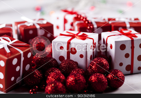 To use this stock image in your creative project, please select the size you need over to the right and click the "Add to Cart" button.
Your downloaded image will come with the Cutcaster watermark removed so don’t worry about the watermark you see on this page. Gifts stock photo, Photography of baubles and gift connected with Christmas time and Christmas tree. by Sebastian Duda