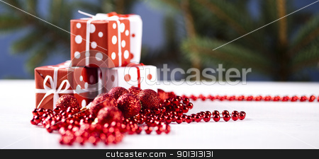 To use this stock image in your creative project, please select the size you need over to the right and click the "Add to Cart" button.
Your downloaded image will come with the Cutcaster watermark removed so don’t worry about the watermark you see on this page. Christmas gifts stock photo, Photography of baubles and gift connected with Christmas time and Christmas tree. by Sebastian Duda