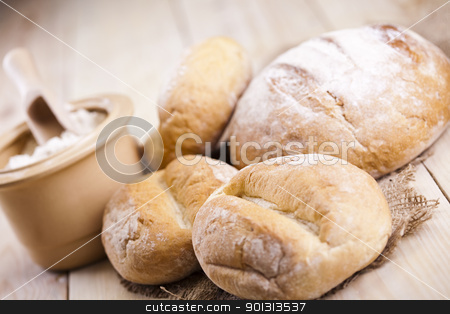 To use this stock image in your creative project, please select the size you need over to the right and click the "Add to Cart" button.
Your downloaded image will come with the Cutcaster watermark removed so don’t worry about the watermark you see on this page. Loaf of bread over background stock photo, Still-life assortment of baked bread. by Sebastian Duda