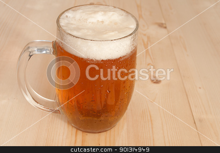 To use this stock image in your creative project, please select the size you need over to the right and click the "Add to Cart" button.
Your downloaded image will come with the Cutcaster watermark removed so don’t worry about the watermark you see on this page. Glass of Beer stock photo, Glass Full of Beer on Wooden Table by JAMDesign