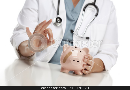 To use this stock image in your creative project, please select the size you need over to the right and click the "Add to Cart" button.
Your downloaded image will come with the Cutcaster watermark removed so don’t worry about the watermark you see on this page. Doctor Gives Okay Sign Behind Piggy Bank stock photo, Female Doctor Gives the Okay Sign Behind Pink Piggy Bank with Bandage. by Andy Dean