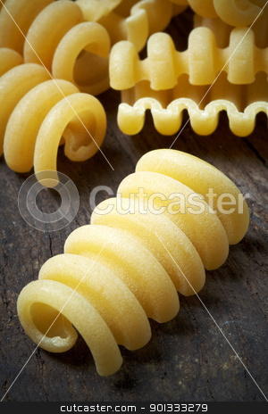 To use this stock image in your creative project, please select the size you need over to the right and click the "Add to Cart" button.
Your downloaded image will come with the Cutcaster watermark removed so don’t worry about the watermark you see on this page. Italian raw pasta stock photo, close up of Italian raw pasta on wood by maxg71
