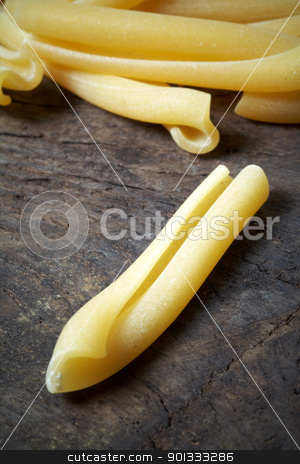 To use this stock image in your creative project, please select the size you need over to the right and click the "Add to Cart" button.
Your downloaded image will come with the Cutcaster watermark removed so don’t worry about the watermark you see on this page. Italian raw pasta stock photo, close up of Italian raw pasta on wood by maxg71