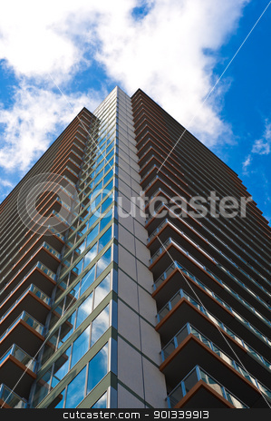 To use this stock image in your creative project, please select the size you need over to the right and click the "Add to Cart" button.
Your downloaded image will come with the Cutcaster watermark removed so don’t worry about the watermark you see on this page. Skyscraper front view with blue sky stock photo, Office buiding front view with blue sky by Ulrich Schade