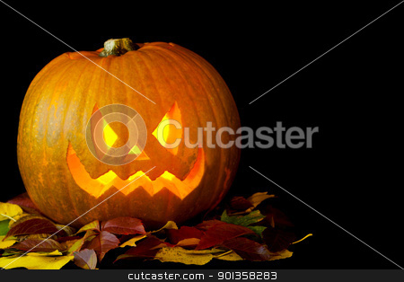 To use this stock image in your creative project, please select the size you need over to the right and click the "Add to Cart" button.
Your downloaded image will come with the Cutcaster watermark removed so don’t worry about the watermark you see on this page. Jack o Lantern stock photo, Carved pumpkin with a candle burning inside and some autumn leaves by mato020