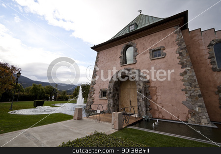 To use this stock image in your creative project, please select the size you need over to the right and click the "Add to Cart" button.
Your downloaded image will come with the Cutcaster watermark removed so don’t worry about the watermark you see on this page. Fountain House stock photo, A house entrance surrounded by a pond and fountains by Kevin Tietz
