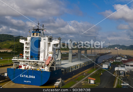 To use this stock image in your creative project, please select the size you need over to the right and click the "Add to Cart" button.
Your downloaded image will come with the Cutcaster watermark removed so don’t worry about the watermark you see on this page. Panama canal stock photo, PANAMA CANAL , PANAMA - DEC 25 2010 : Huge ship crossing the Panama canal by Kobby Dagan
