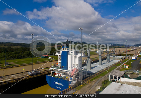 To use this stock image in your creative project, please select the size you need over to the right and click the "Add to Cart" button.
Your downloaded image will come with the Cutcaster watermark removed so don’t worry about the watermark you see on this page. Panama canal stock photo, PANAMA CANAL , PANAMA - DEC 25 2010 : Huge ship crossing the Panama canal by Kobby Dagan