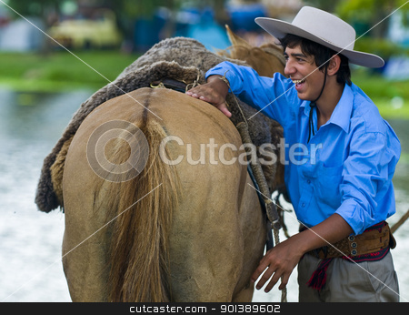 To use this stock image in your creative project, please select the size you need over to the right and click the "Add to Cart" button.
Your downloaded image will come with the Cutcaster watermark removed so don’t worry about the watermark you see on this page. Gaucho festival stock photo, TACUAREMBO, URUGUAY - MAR 5 : Participant in the annual festival