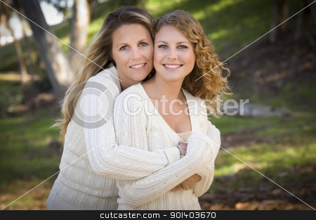 To use this stock image in your creative project, please select the size you need over to the right and click the "Add to Cart" button.
Your downloaded image will come with the Cutcaster watermark removed so don’t worry about the watermark you see on this page. Pretty Mother and Daughter Portrait in Park stock photo, Pretty Mother and Daughter Portrait Hugging in the Park on a Fall Day. by Andy Dean