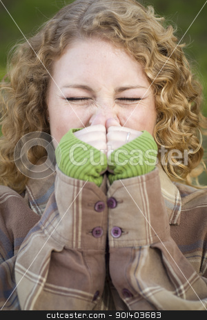 To use this stock image in your creative project, please select the size you need over to the right and click the "Add to Cart" button.
Your downloaded image will come with the Cutcaster watermark removed so don’t worry about the watermark you see on this page. Pretty Young Woman Sneezing stock photo, Pretty Young Woman Sneezing Outdoors. by Andy Dean