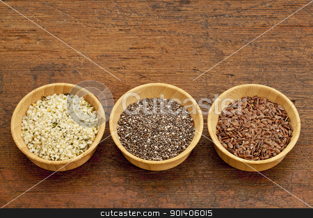 To use this stock image in your creative project, please select the size you need over to the right and click the "Add to Cart" button.
Your downloaded image will come with the Cutcaster watermark removed so don’t worry about the watermark you see on this page. chia, flax and hemp seeds stock photo, chia, flax and hemp healthy seeds in small wooden bowls by Marek Uliasz