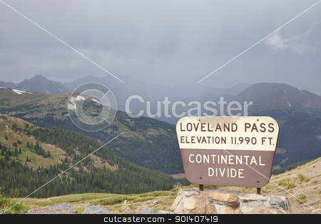 To use this stock image in your creative project, please select the size you need over to the right and click the "Add to Cart" button.
Your downloaded image will come with the Cutcaster watermark removed so don’t worry about the watermark you see on this page. Loveland Pass - continental divide stock photo, a sign at Loveland Pass and continental divide in Colorado Rocky Mountains - a summer cloudy and foggy day by Marek Uliasz