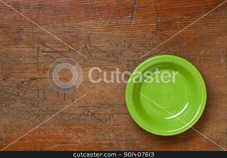 To use this stock image in your creative project, please select the size you need over to the right and click the "Add to Cart" button.
Your downloaded image will come with the Cutcaster watermark removed so don’t worry about the watermark you see on this page. green bowl on grunge wood stock photo, green ceramic bowl on grunge scratched wood surface by Marek Uliasz