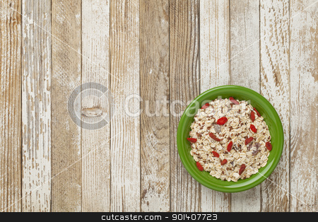 To use this stock image in your creative project, please select the size you need over to the right and click the "Add to Cart" button.
Your downloaded image will come with the Cutcaster watermark removed so don’t worry about the watermark you see on this page. muesli cereal bowl stock photo, bowl of muesli cereal with raisins, flux seeds and goji berries against grunge wood table by Marek Uliasz