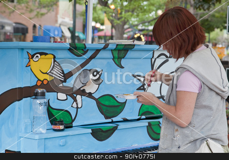 To use this stock image in your creative project, please select the size you need over to the right and click the "Add to Cart" button.
Your downloaded image will come with the Cutcaster watermark removed so don’t worry about the watermark you see on this page. Painting mural on the piano stock photo, FORT COLLINS, COLORADO, USA - JUNE 18, 2011: Artist Ren Burke is painting a mural on the piano in Fort Collins Old Town Square as part of Pianos About Town public art program. June 18, 2011. by Marek Uliasz