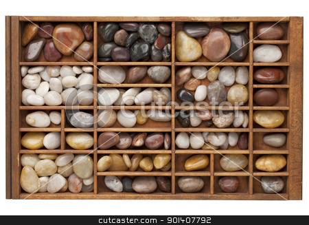 To use this stock image in your creative project, please select the size you need over to the right and click the "Add to Cart" button.
Your downloaded image will come with the Cutcaster watermark removed so don’t worry about the watermark you see on this page. river pebbles in typesetter drawer stock photo, colorful river pebbles in vintage wood typesetter drawer isolated with clipping path by Marek Uliasz