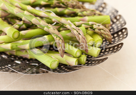 To use this stock image in your creative project, please select the size you need over to the right and click the "Add to Cart" button.
Your downloaded image will come with the Cutcaster watermark removed so don’t worry about the watermark you see on this page. green asparagus in steamer basket stock photo, green fresh asparagus in a steamer basket ready for steaming by Marek Uliasz