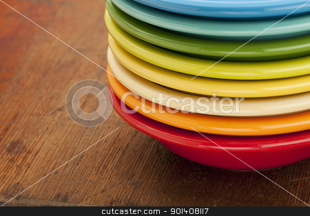 To use this stock image in your creative project, please select the size you need over to the right and click the "Add to Cart" button.
Your downloaded image will come with the Cutcaster watermark removed so don’t worry about the watermark you see on this page. stack of colorful bowls stock photo, stack of colorful ceramic bowls against an old scratched wooden table surface by Marek Uliasz